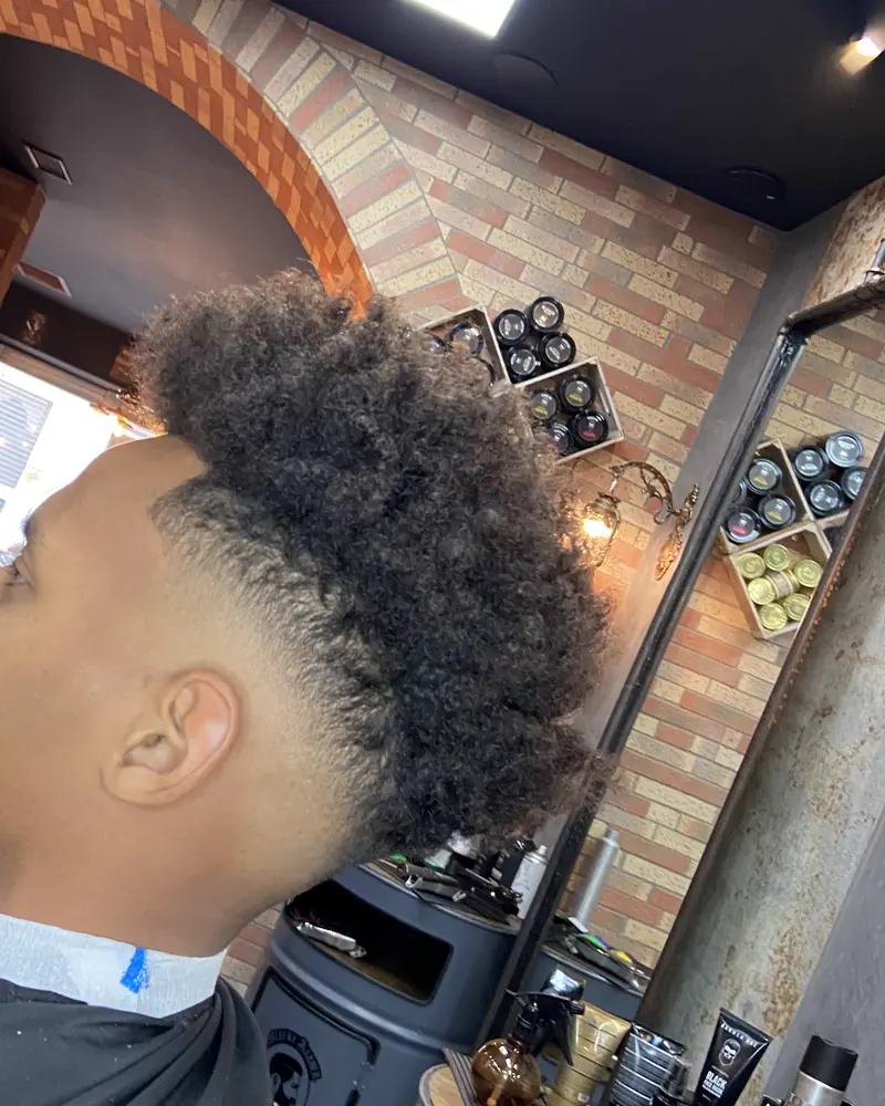 Coupe homme dégradée réalisée chez Allure Barber